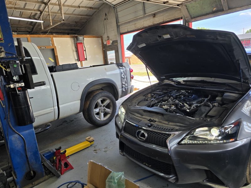 Merlin's Auto Repair & Sales - vehicles in the service bay